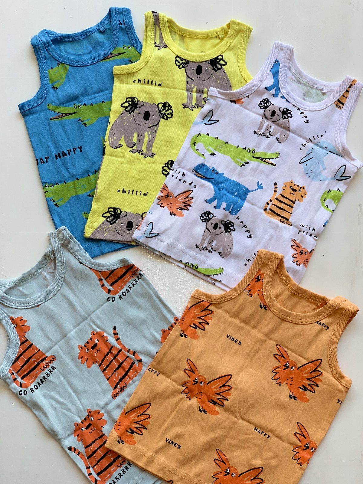 Five colorful sleeveless infant tank tops with animal prints on a white background.
