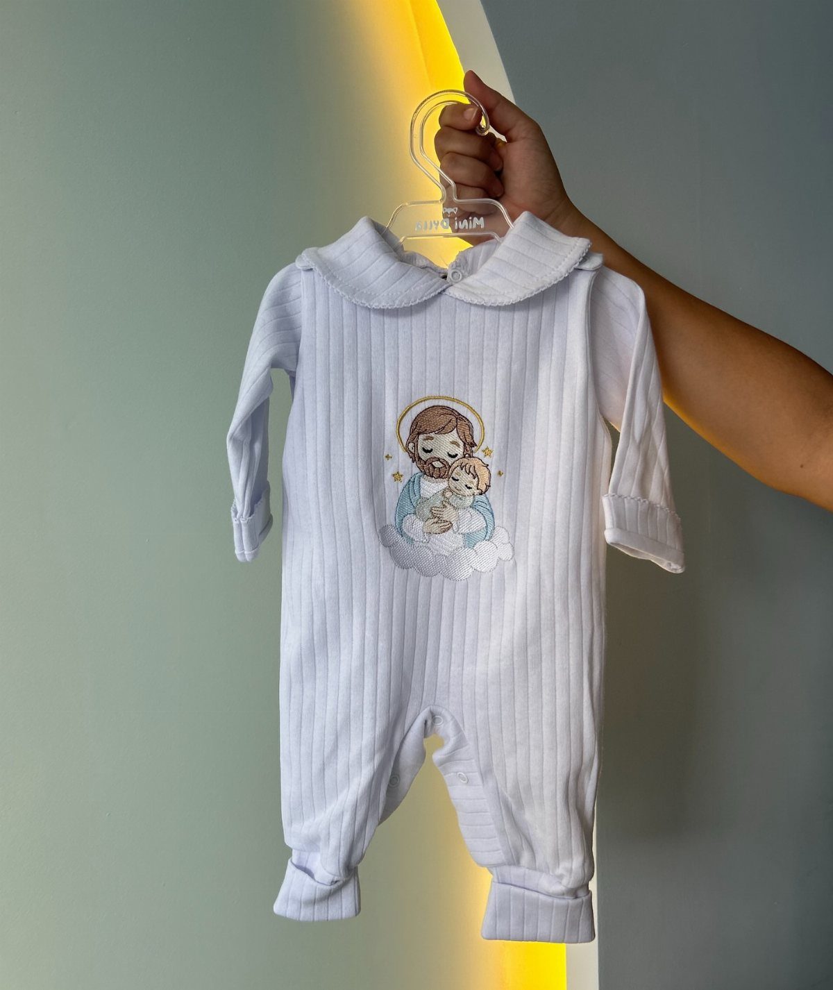 Christian Newborn Clothes for Baptism and Beyond: 5 Ideas 5 White ribbed newborn romper with embroidered Saint Joseph and baby Jesus on chest
