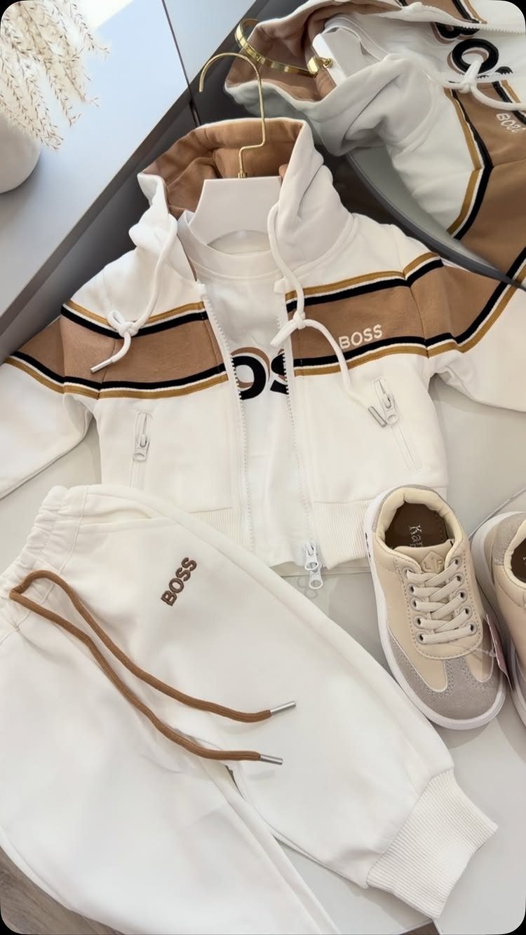 White BOSS baby tracksuit with brown accents and matching beige sneakers.