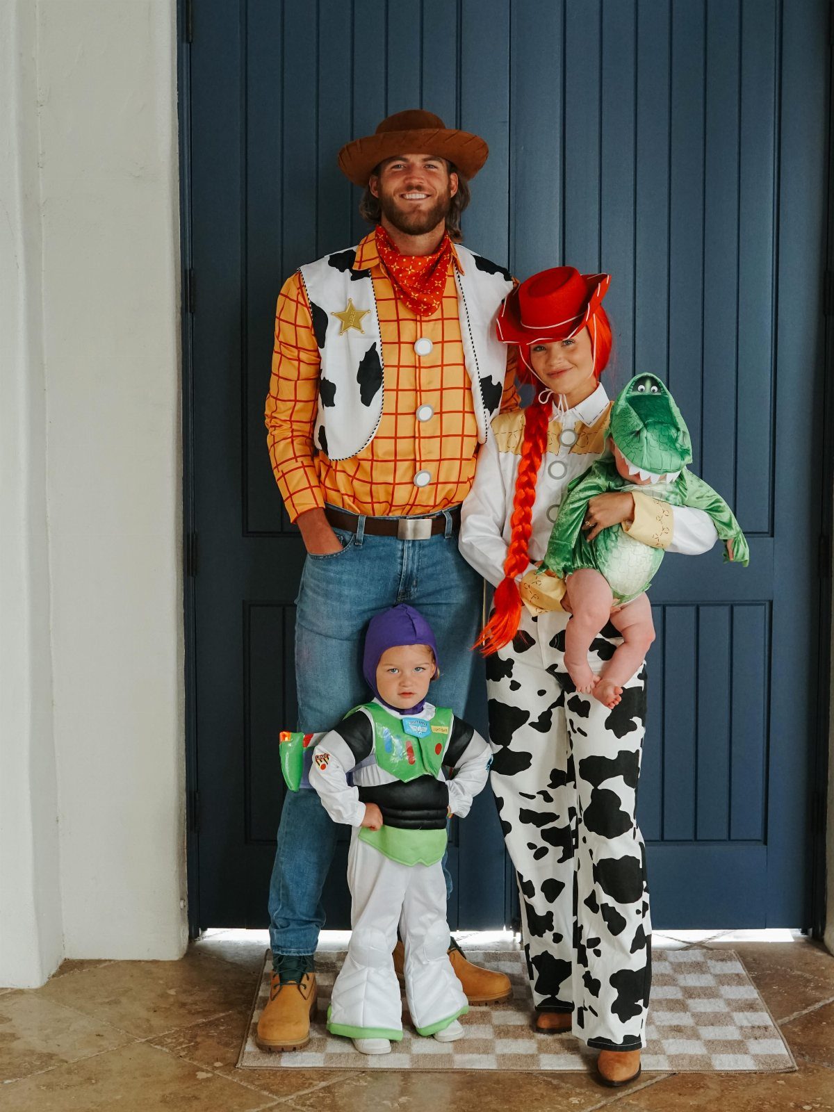 Family dressed as Toy Story characters including Woody, Jessie, Buzz, and Rex.