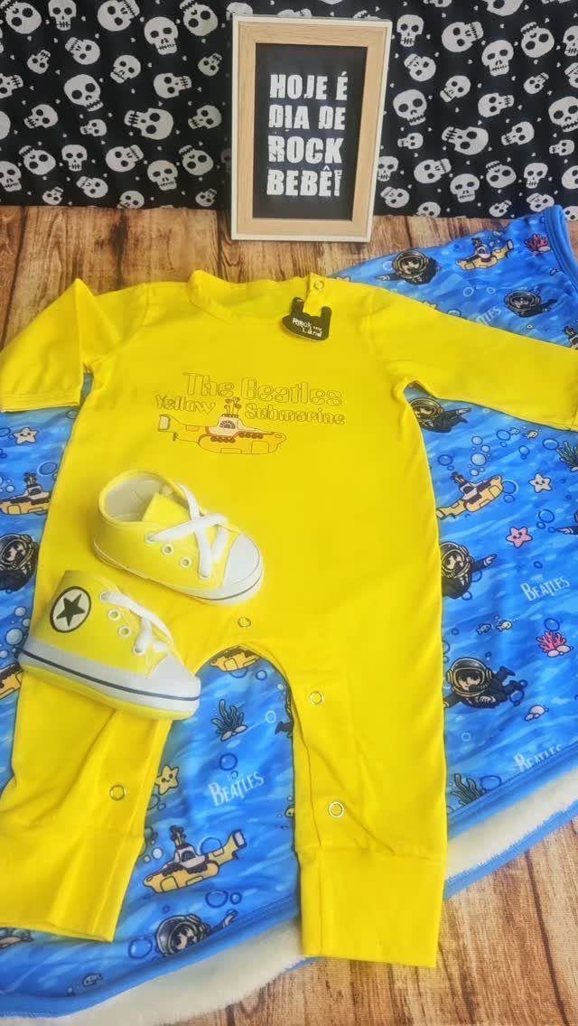 Infant Beatles Clothing: 3 Ideas for Onesies, Bibs and More 1 Yellow Beatles infant onesie and matching sneakers on a blue patterned blanket