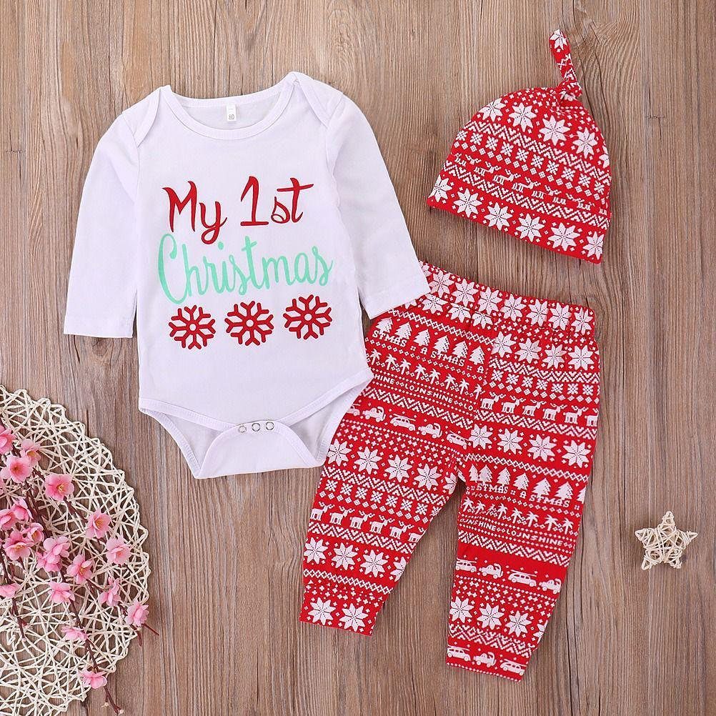Baby outfit set with white bodysuit, red patterned pants, and matching knit hat.