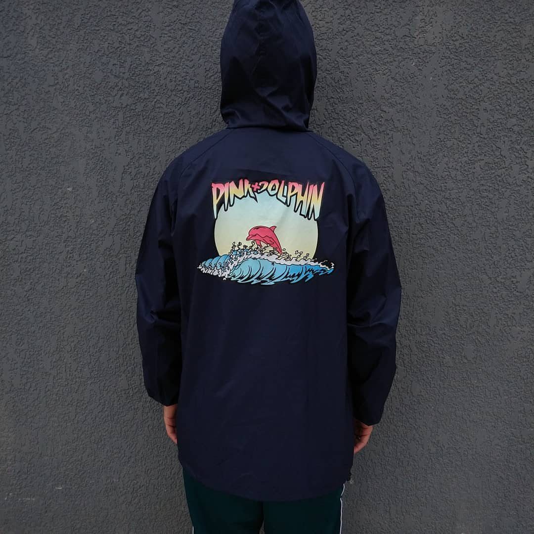 Pink Dolphin Clothing: 7 Ideas for Hoodies, Hats and More 3 Navy blue hooded jacket featuring a pink dolphin graphic and text on the back.