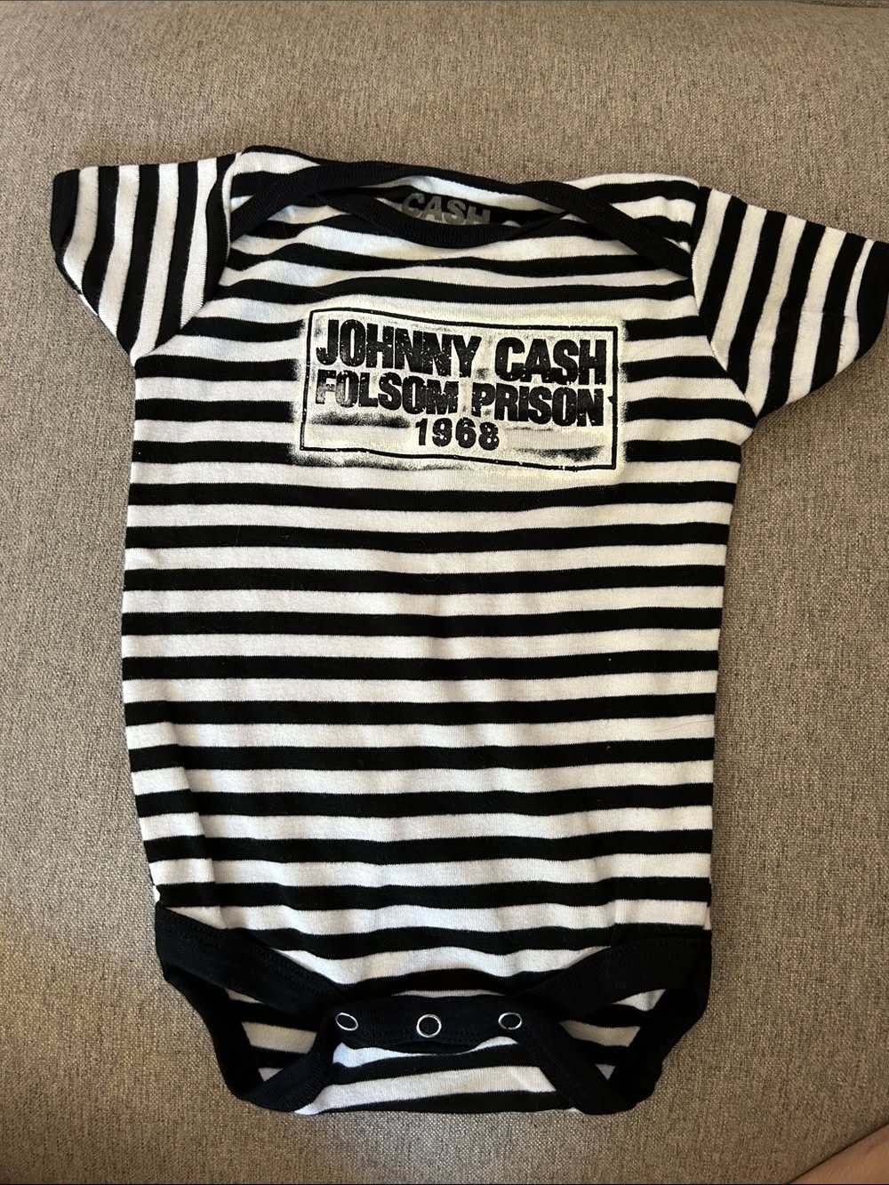 10 Rockabilly Infant Clothing Ideas for Little Rock Stars 3 Black and white striped infant bodysuit with Johnny Cash Folsom Prison graphic.