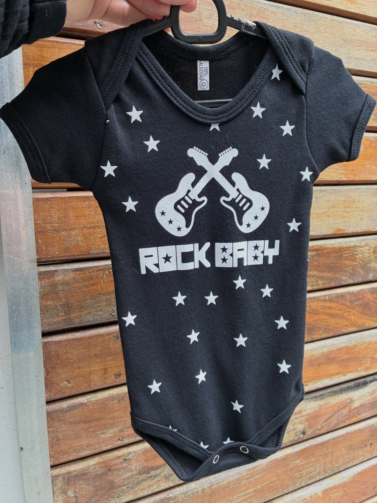 10 Rockabilly Infant Clothing Ideas for Little Rock Stars 1 Black infant bodysuit with white stars, crossed guitars, and ROCK BABY text.