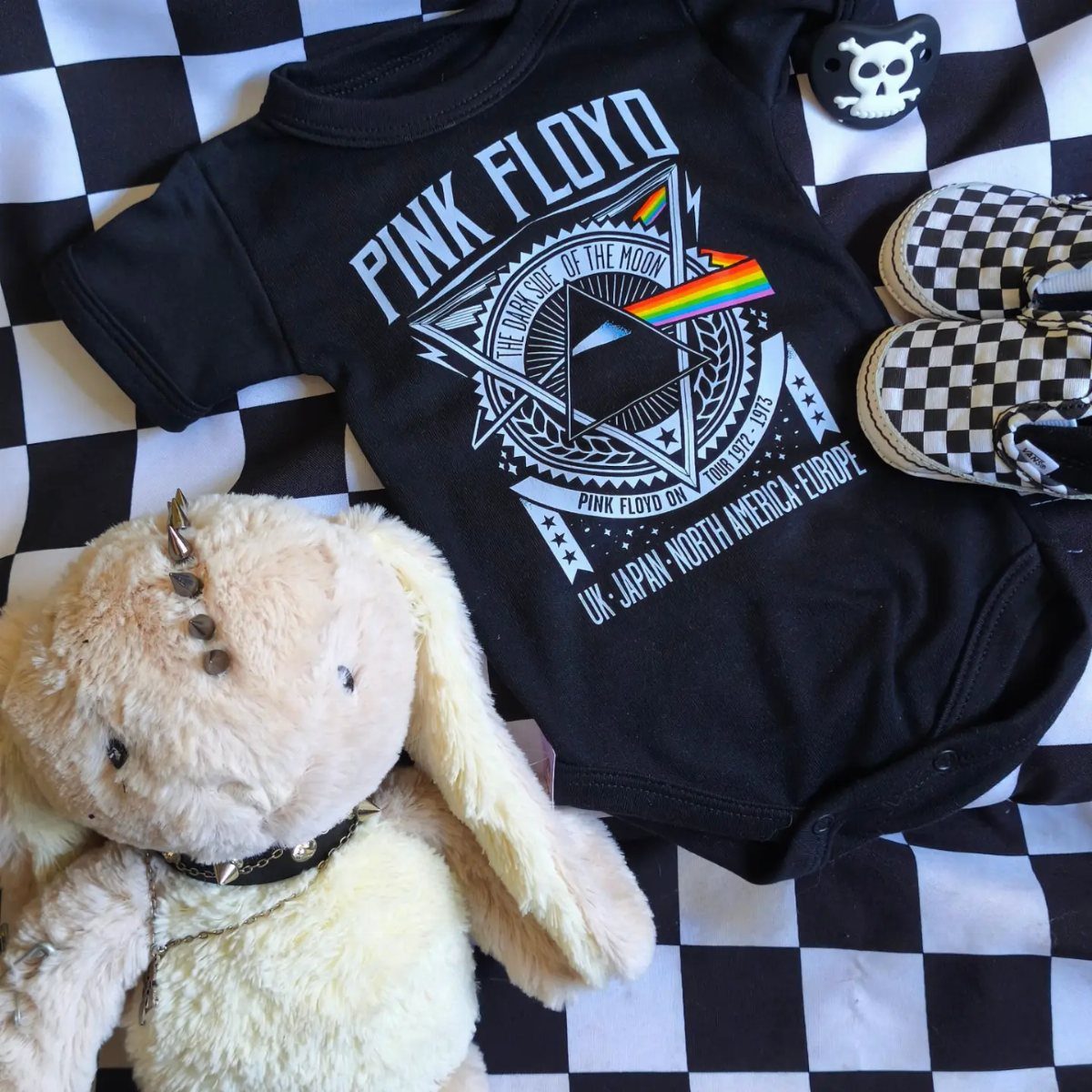 Rockstar Infant Clothing Ideas: 5 Looks for Little Rockers 1 Pink Floyd baby bodysuit with checkered shoes and a spiked collar plush bunny.