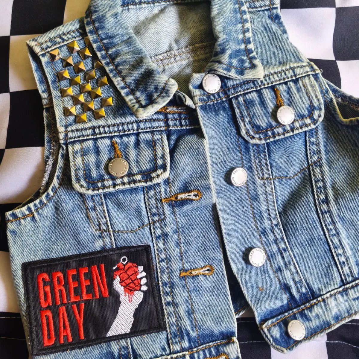 Rockstar Infant Clothing Ideas: 5 Looks for Little Rockers 4 Blue denim infant vest with gold studs and Green Day band patch.